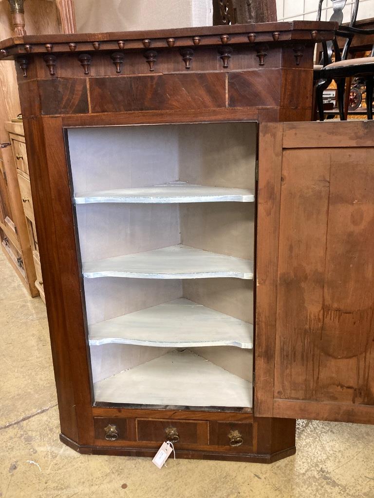 A George III mahogany hanging corner cupboard, width 84cm, depth 43cm, height 121cm